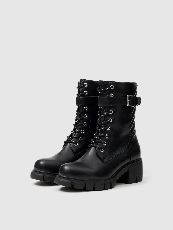 Buckle track sole ankle boot black 45º front view