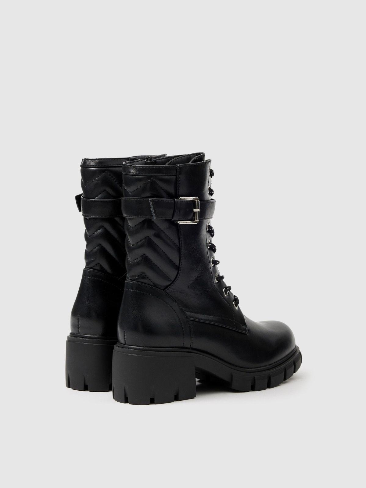 Buckle track sole ankle boot black 45º back view
