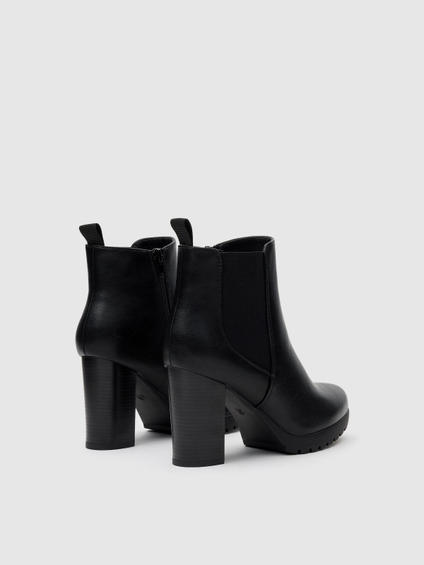 Rubber heeled ankle boots black 45º back view