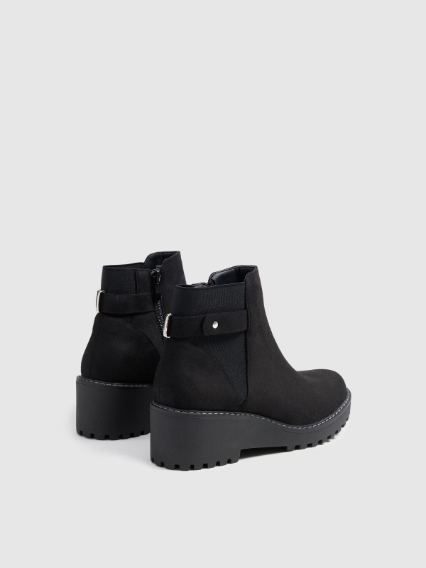 Wedge and buckle boots 45º back view