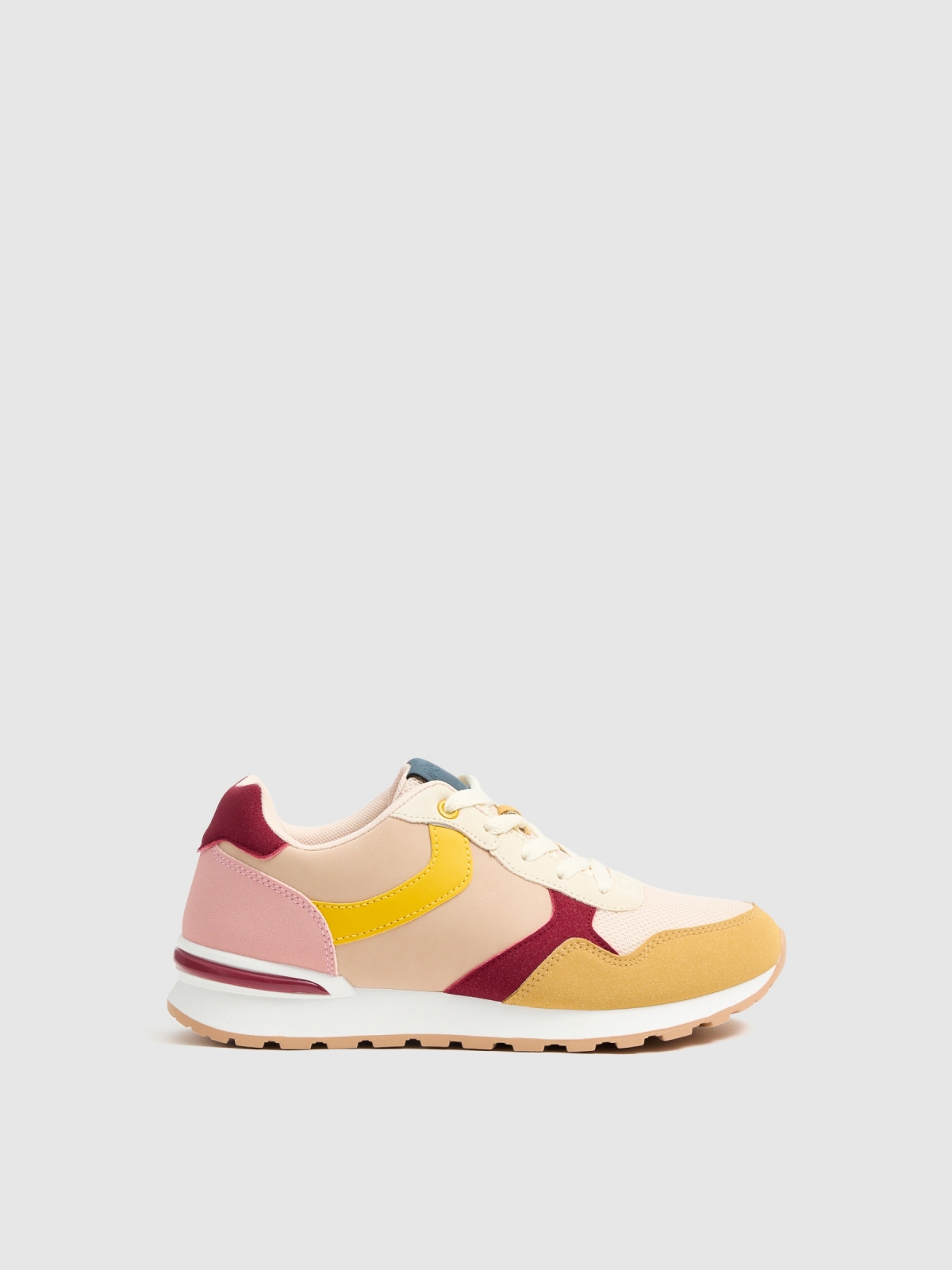 Treinador combinado de várias peças amarelo pastel vista perfil