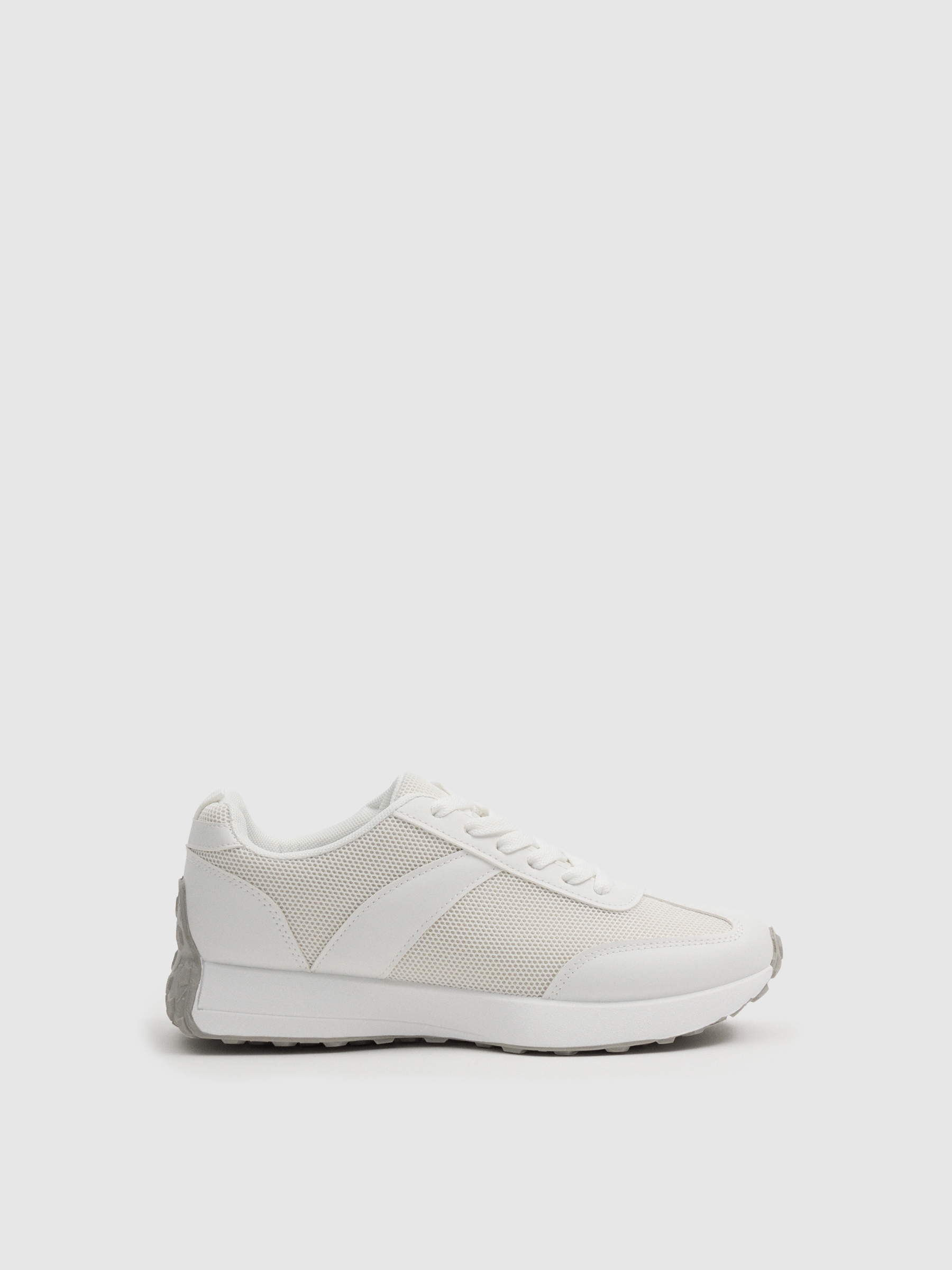 White casual running sneakers white profile view
