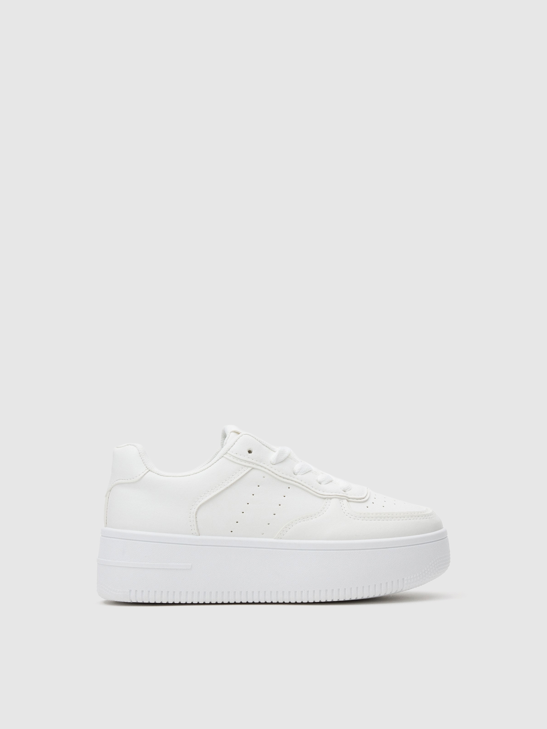 White platform low sneakers white profile view