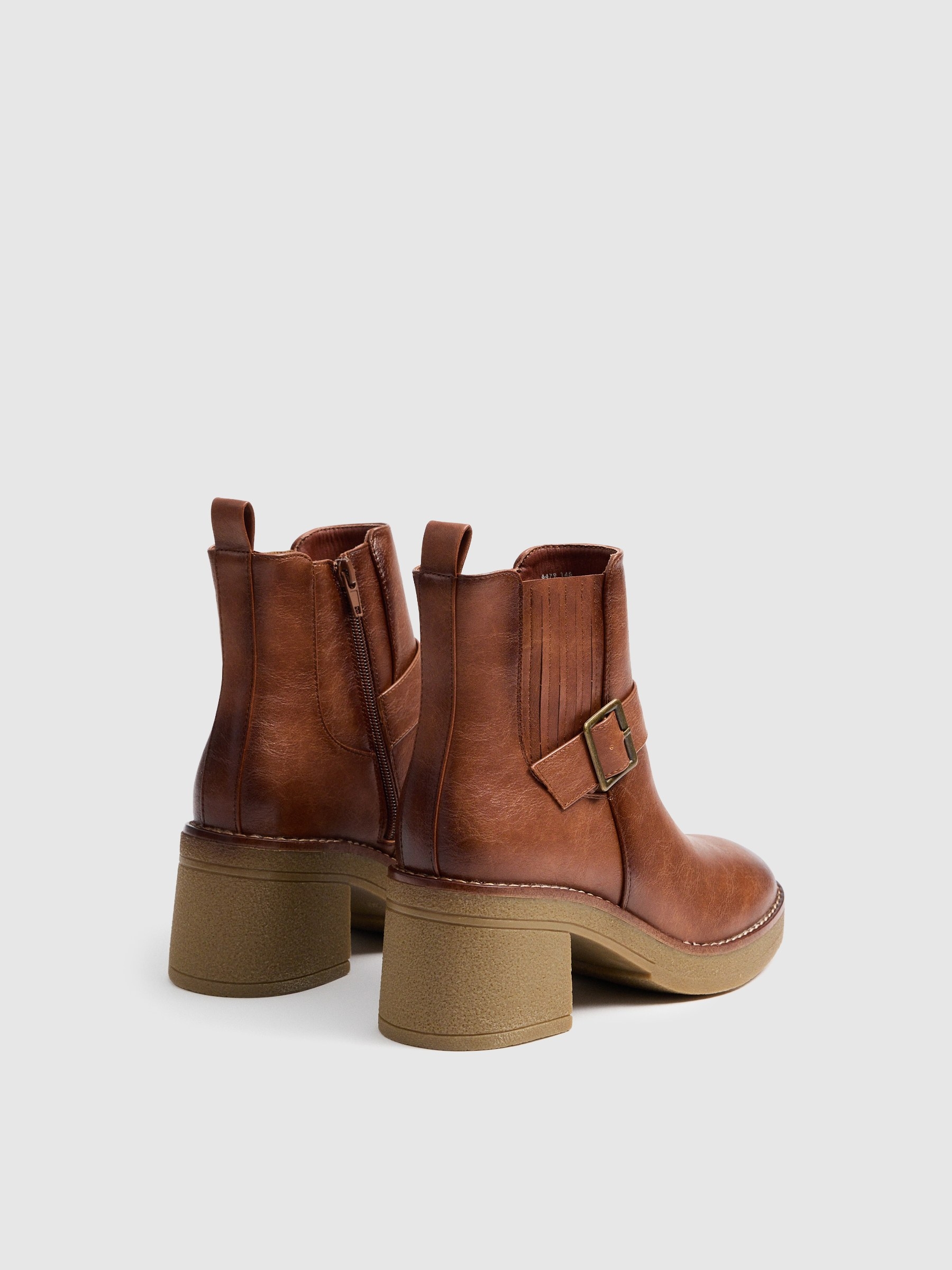 Brown boots with strap brown profile view