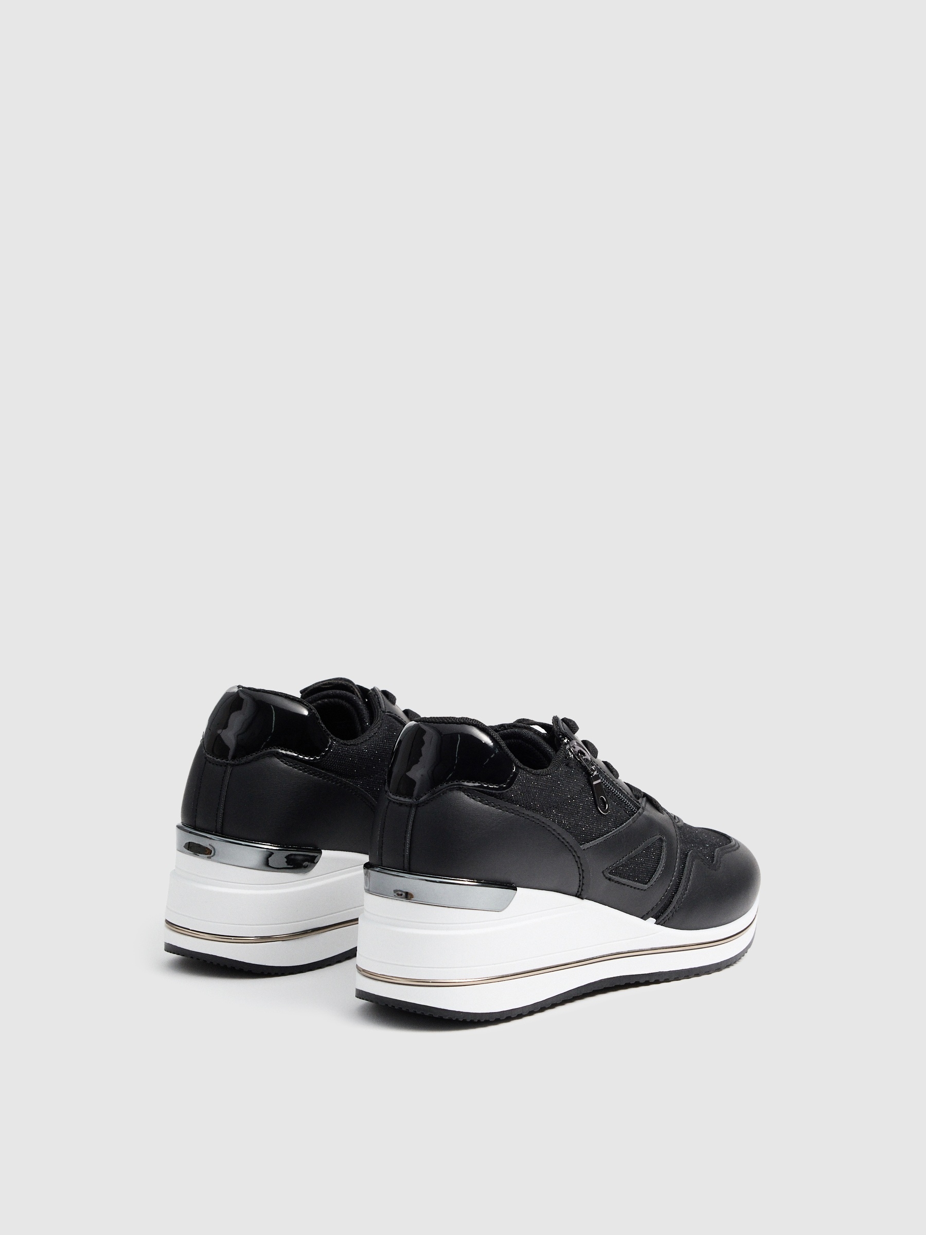 Modern wedge sneakers black profile view