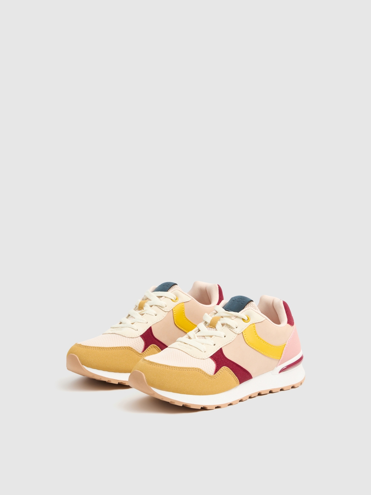 Multi-piece combination sports shoe pastel yellow 45º back view