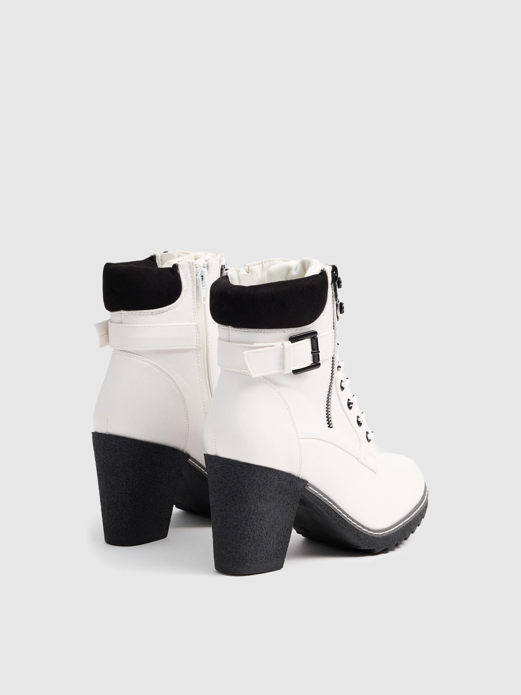 Mountaineering boots with condoms white profile view