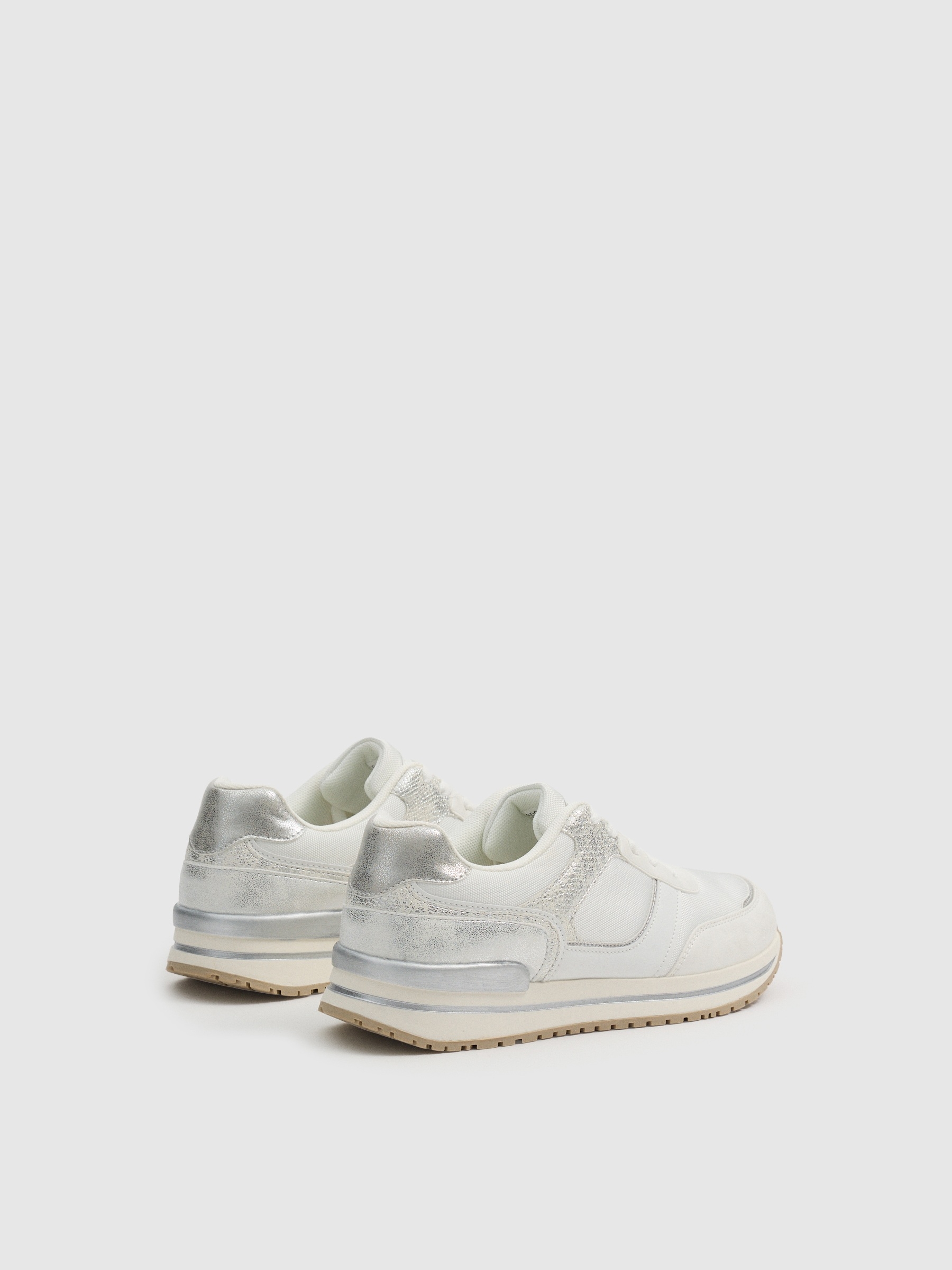 Zapatillas casual running blanco vista perfil