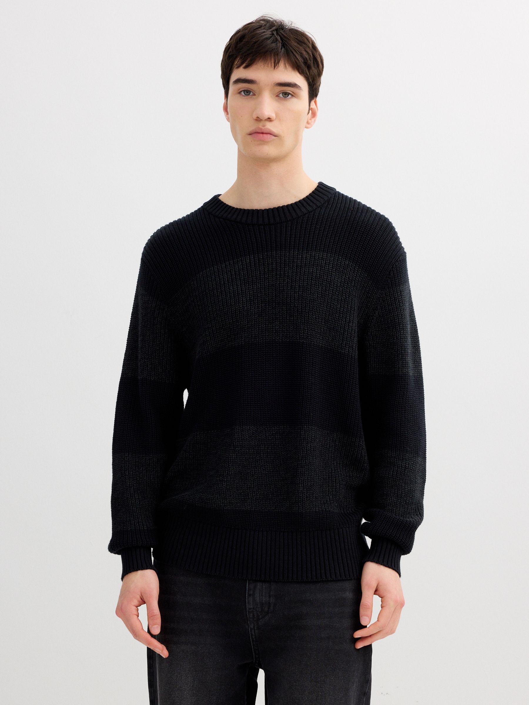Striped knit sweater with a round neck black middle front view