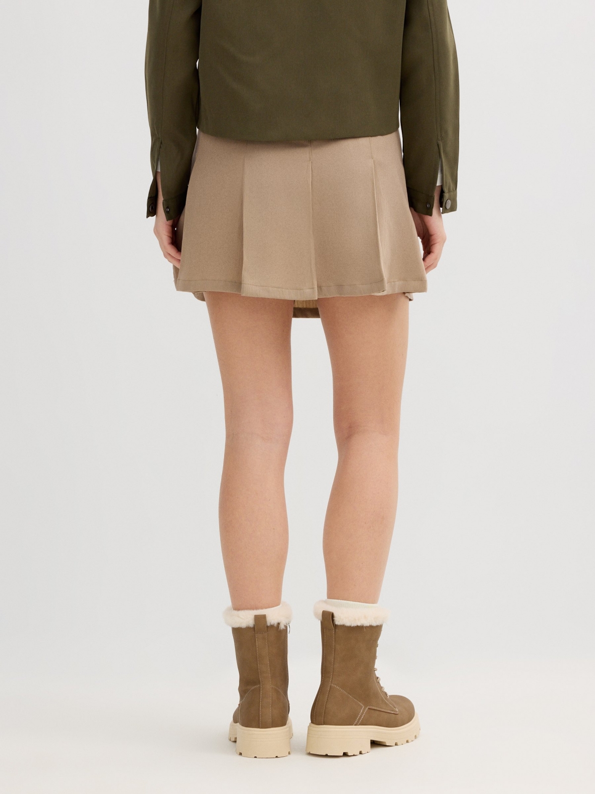 Beige pleated mini skirt sand front view