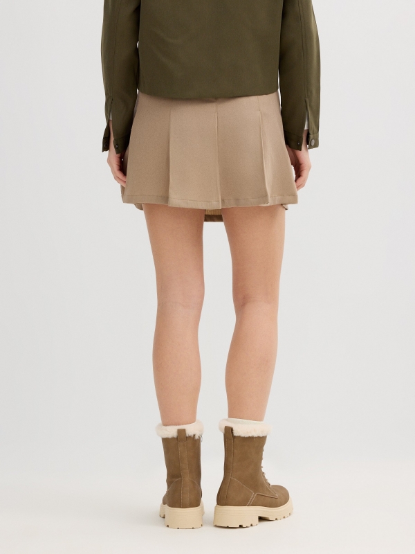 Beige pleated mini skirt sand front view