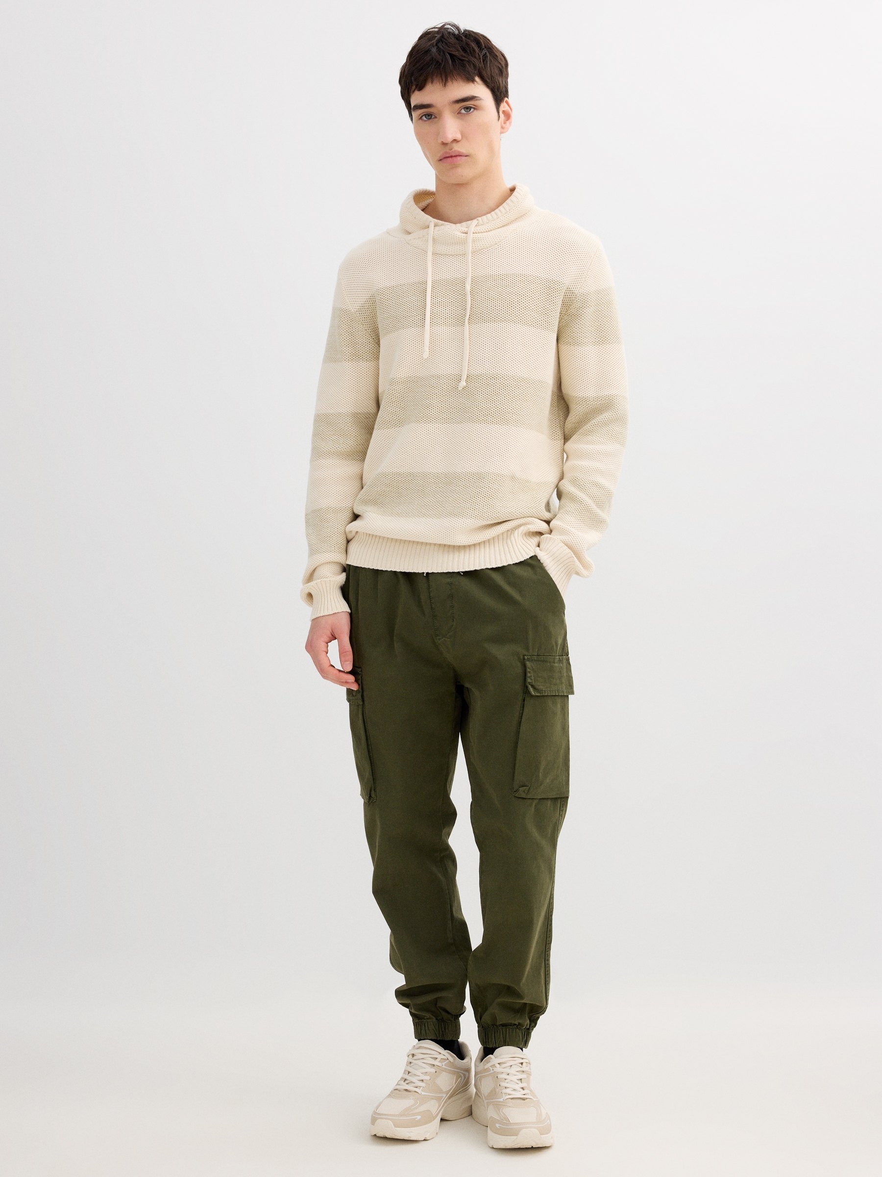 Striped knit sweater raw middle front view