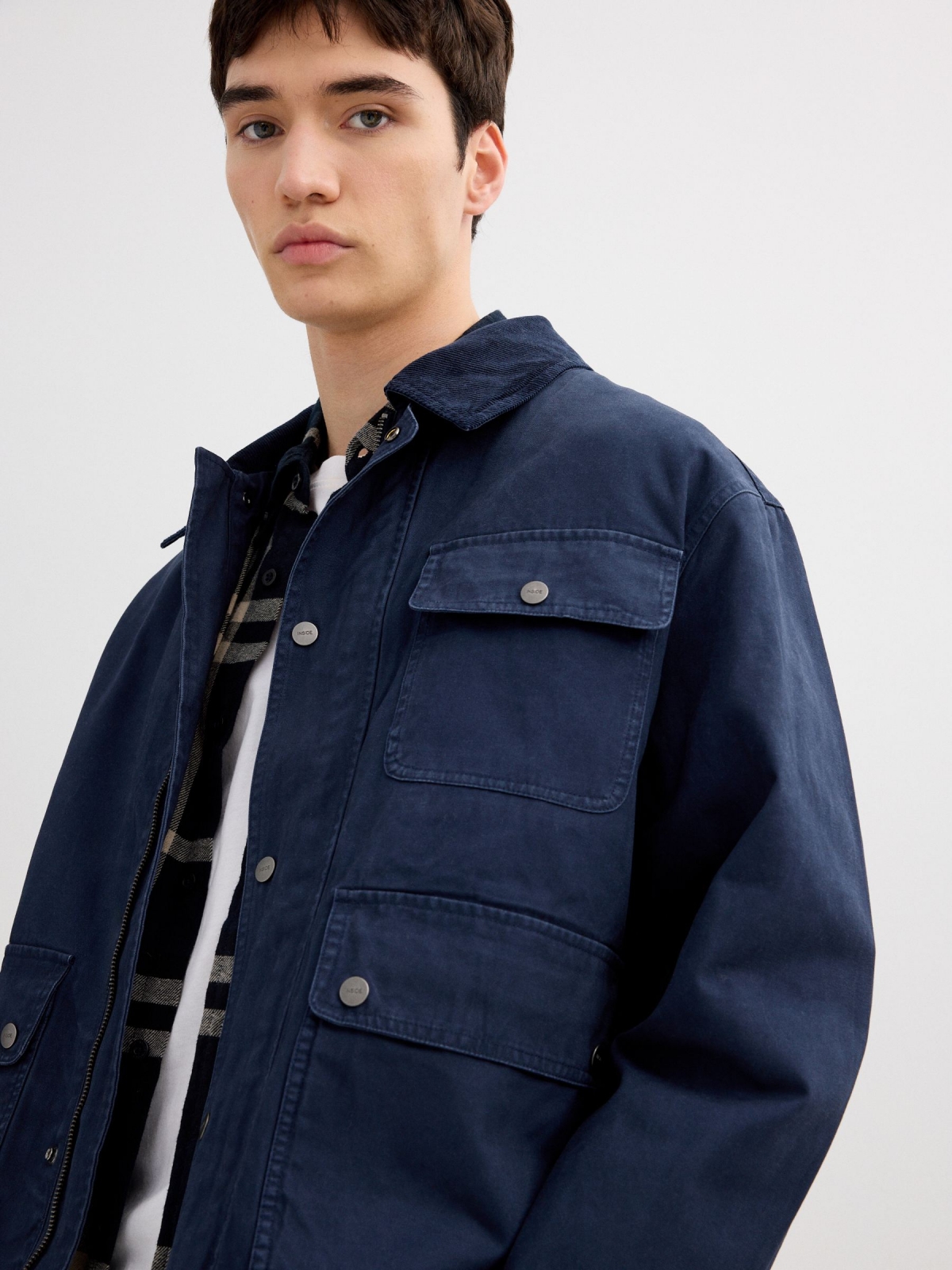 Blue jacket with zipper navy detail view
