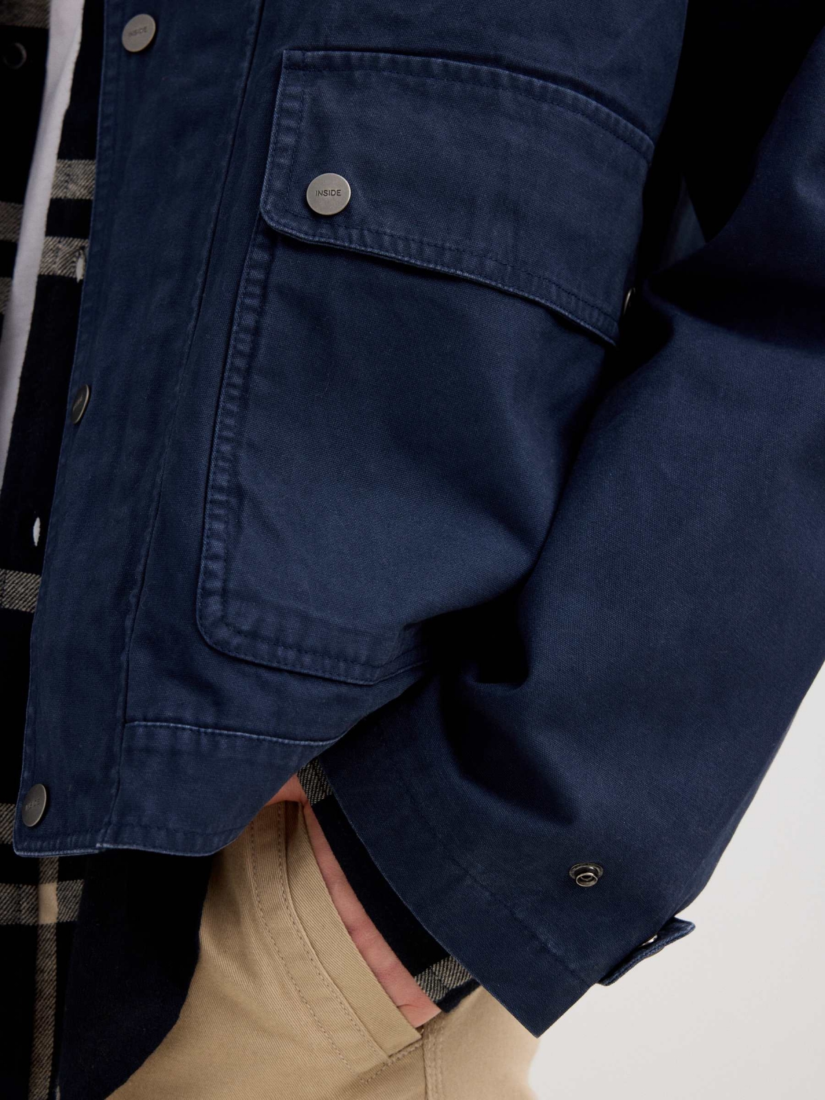 Blue jacket with zipper navy detail view