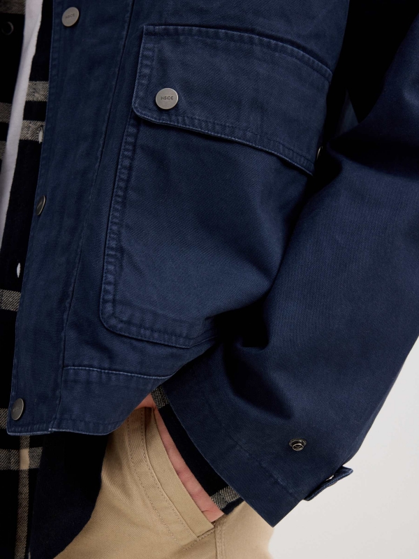 Blue jacket with zipper navy detail view