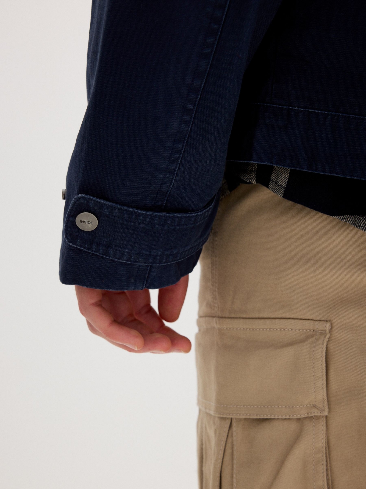 Blue jacket with zipper navy detail view