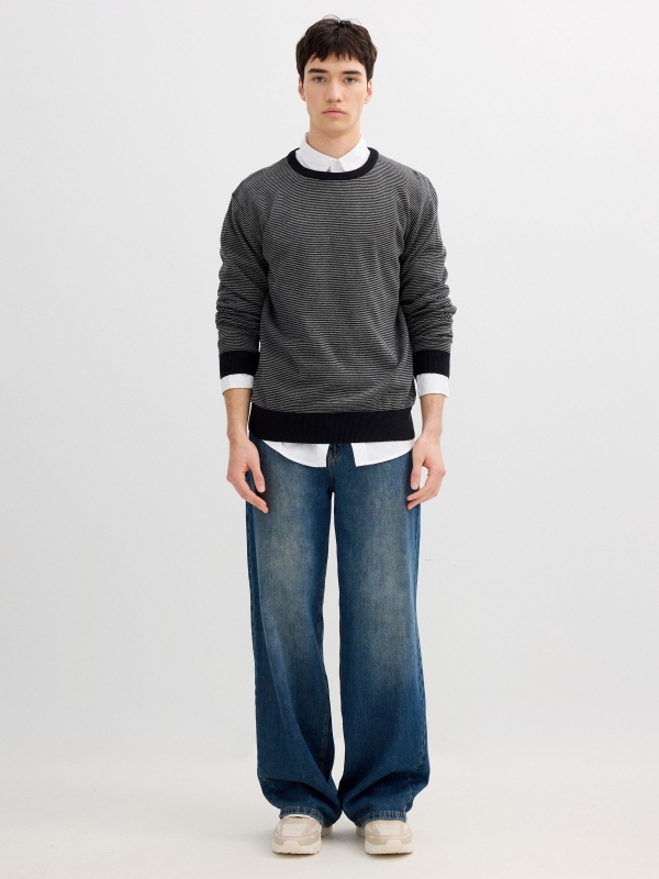 Striped knit sweater with a round neck black front view