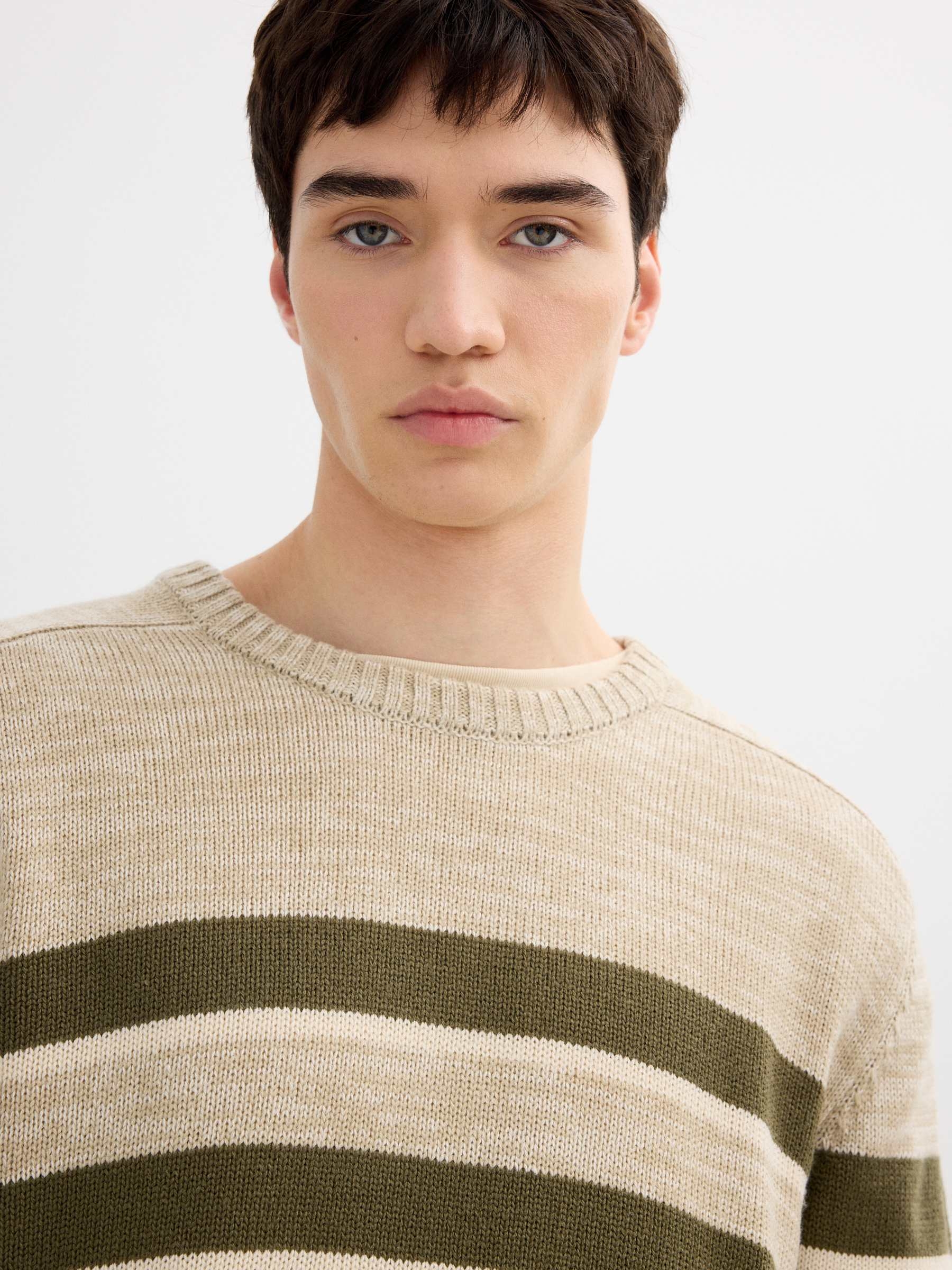 Striped knit sweater raw middle front view