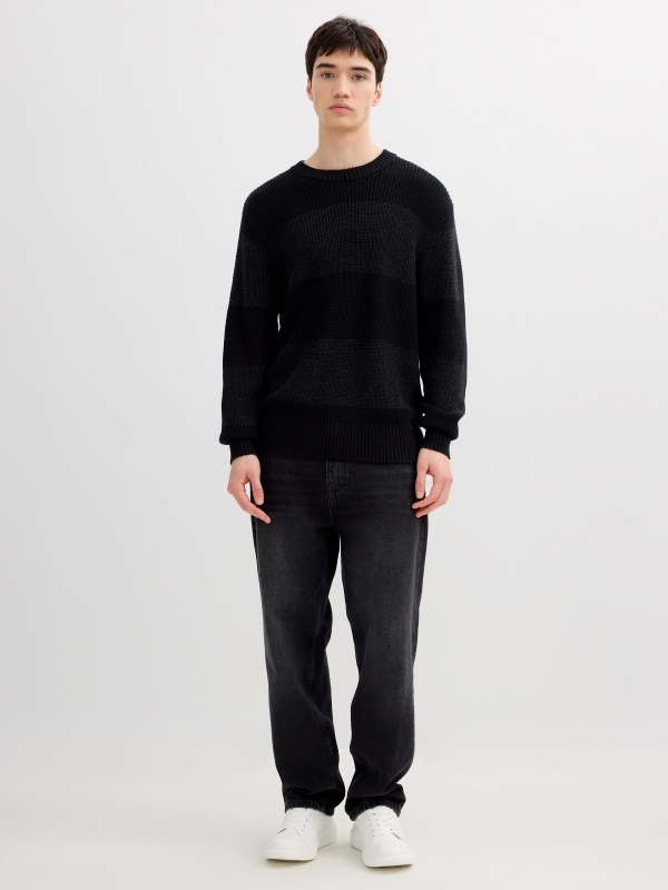 Striped knit sweater with a round neck black front view