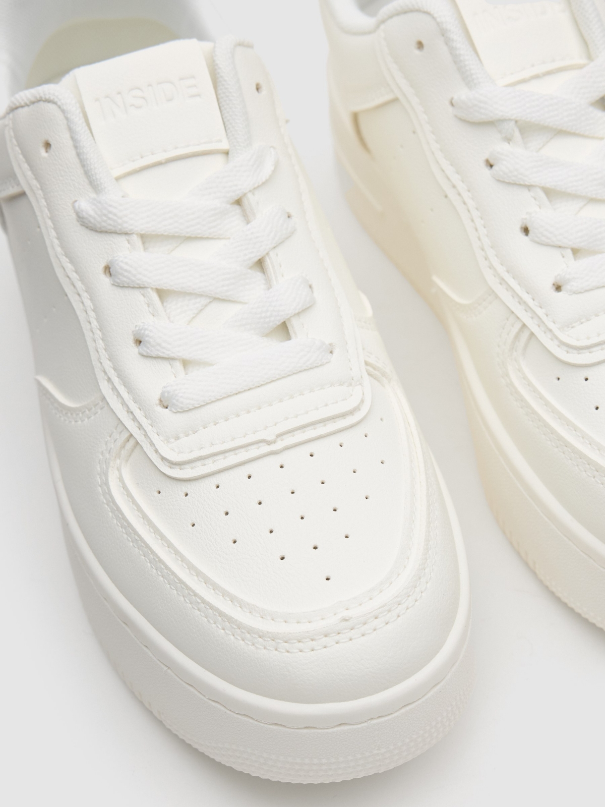 Faux leather sports shoe with platform white detail view