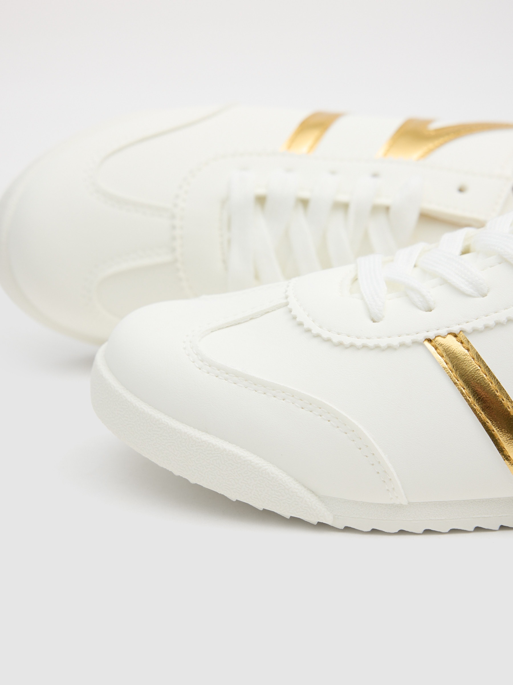Faux leather sports with golden details golden