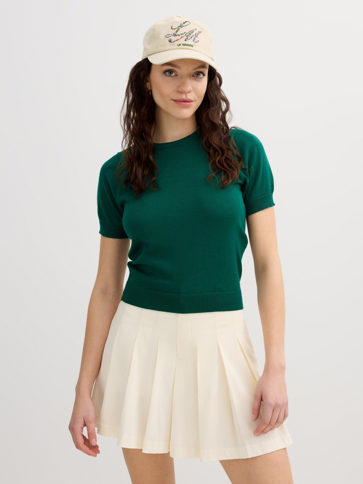 Pleated skort off white middle back view