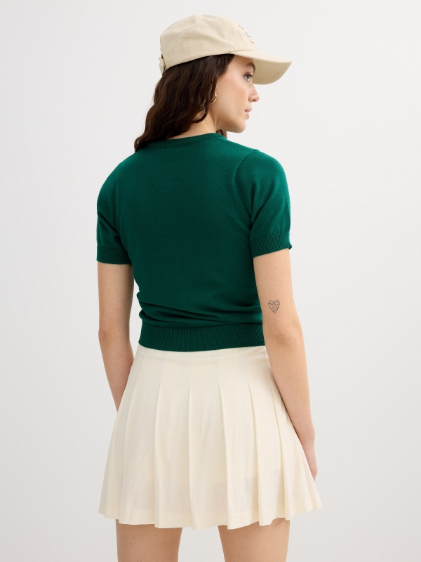 Pleated skort off white front view