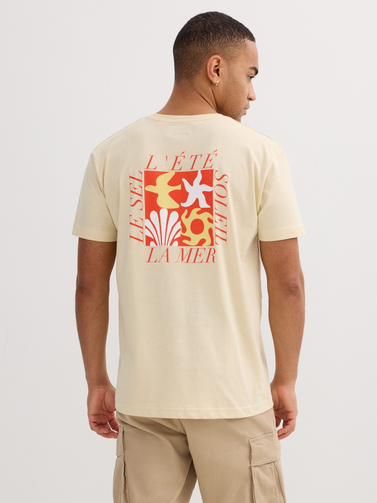 Blue tropical print t-shirt sand middle back view