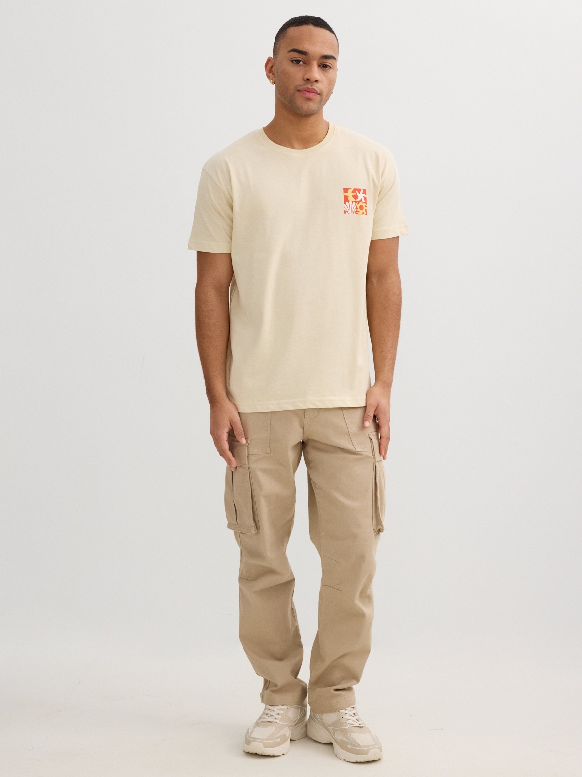Blue tropical print t-shirt sand front view
