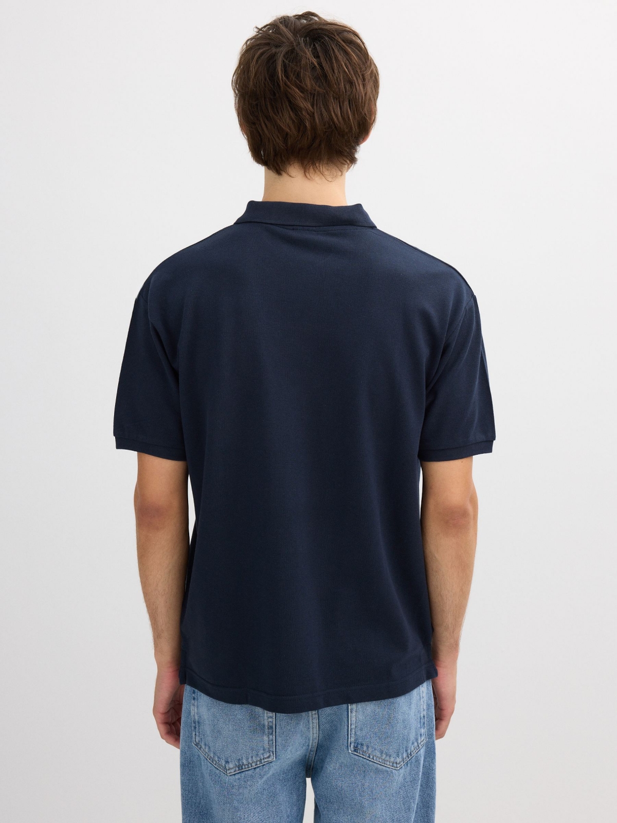 Basic polo navy middle back view