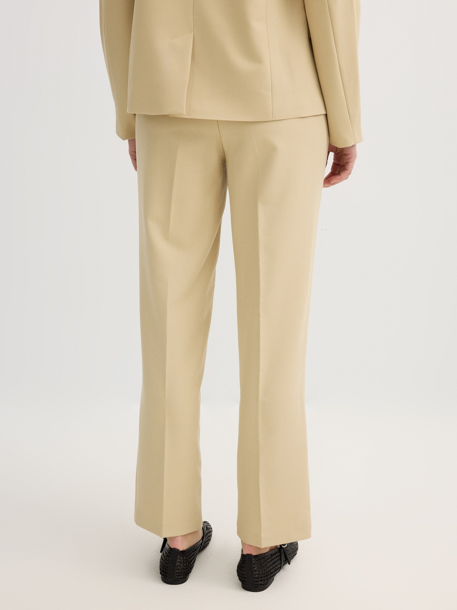High-waisted pleated linen pants sand front view