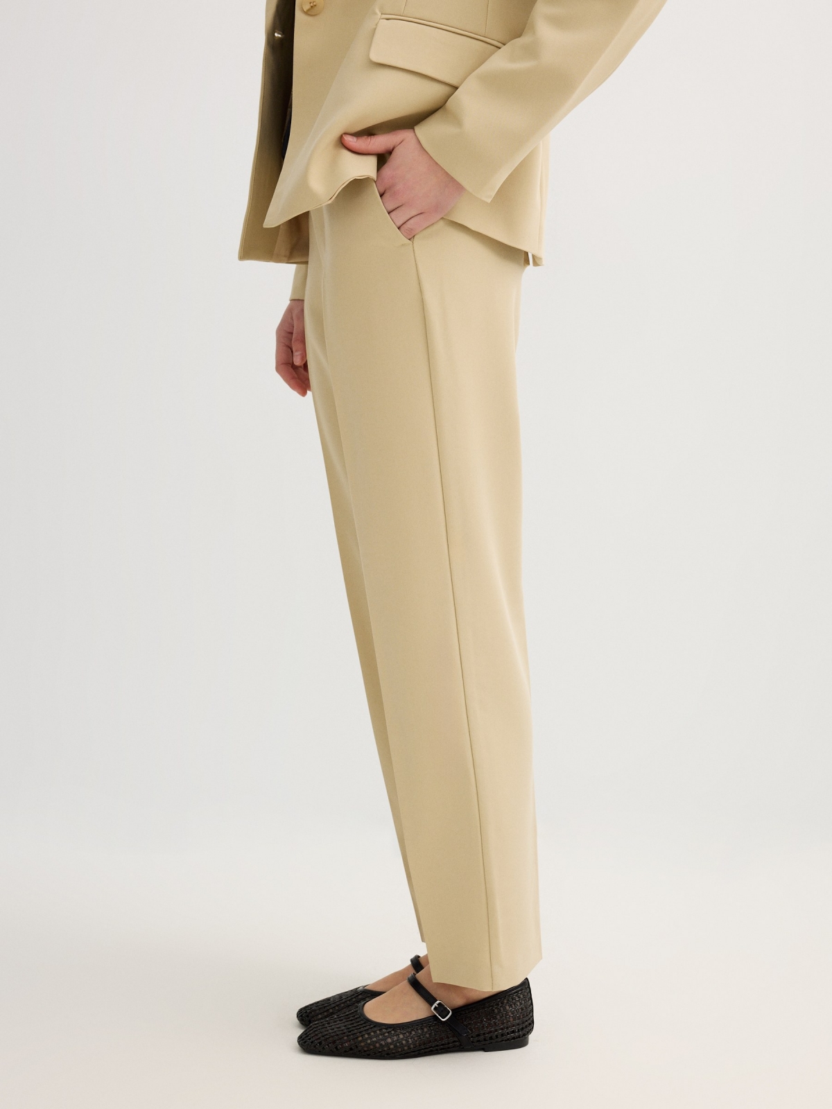 High-waisted pleated linen pants sand detail view