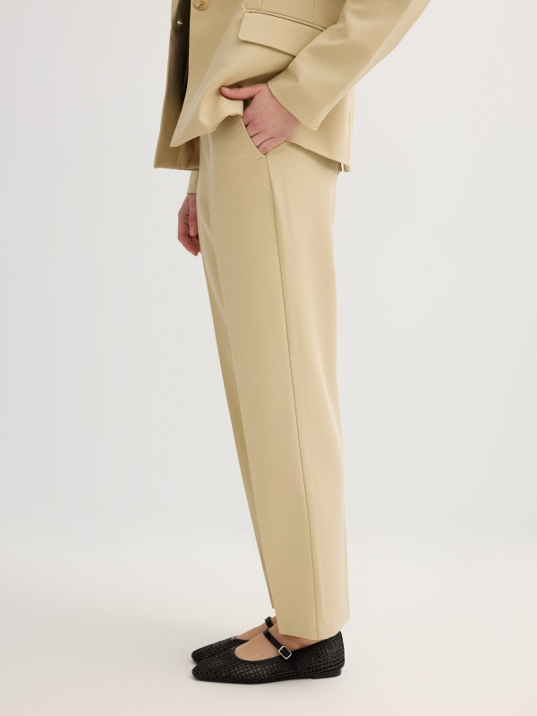 High-waisted pleated linen pants sand detail view