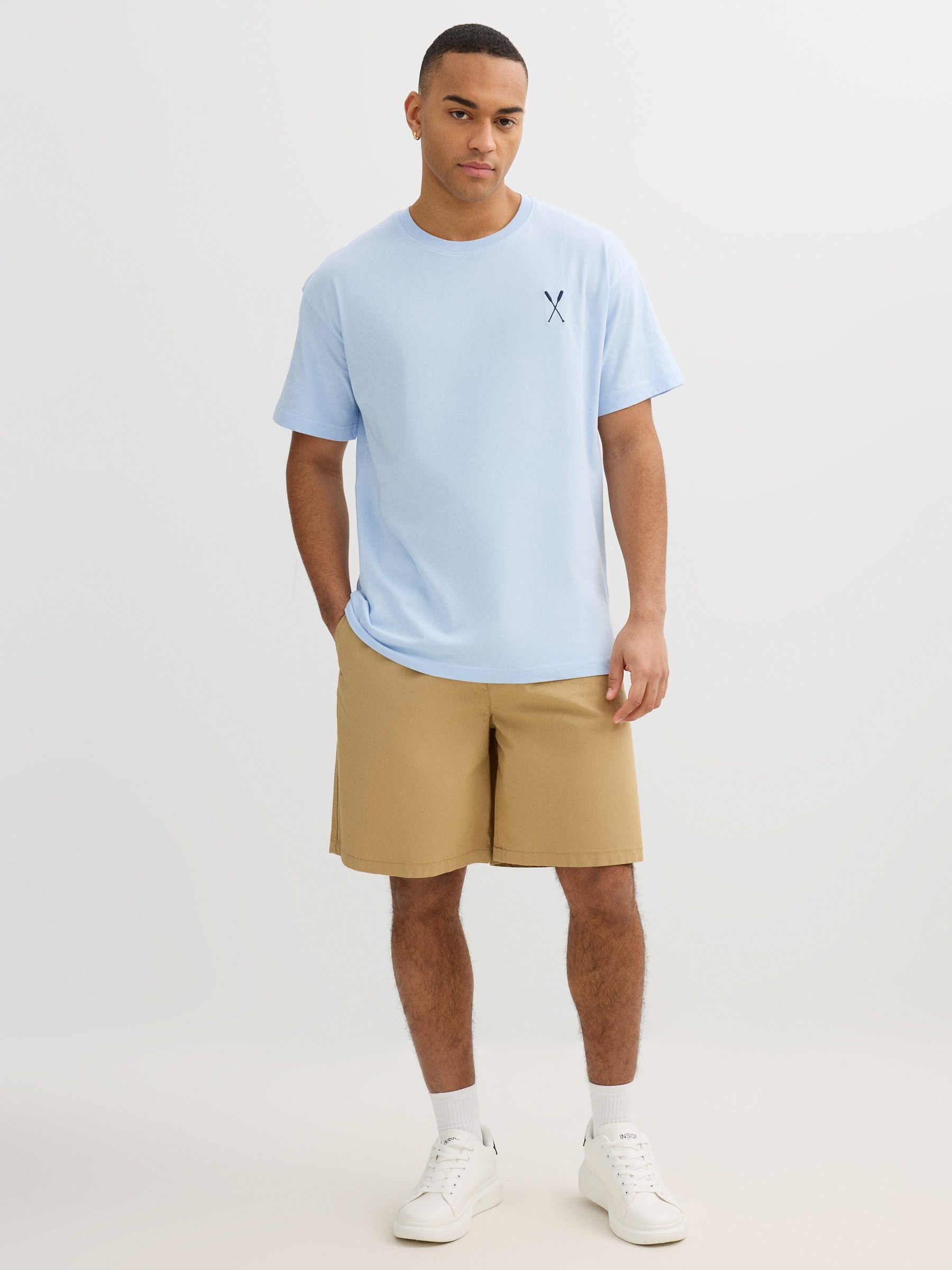 Blue shirt with minimal detail light blue middle front view