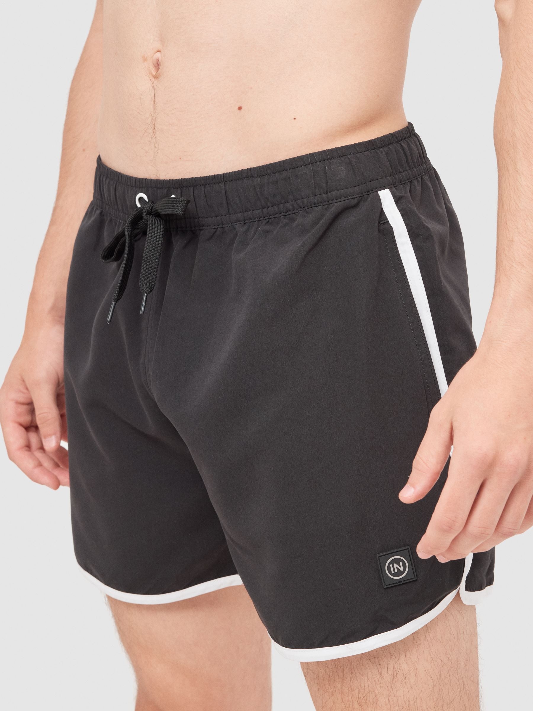 Contrast trim short swimsuit black middle front view