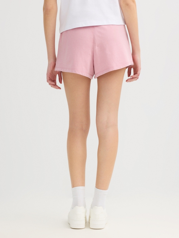 High-waisted fleece shorts pink front view