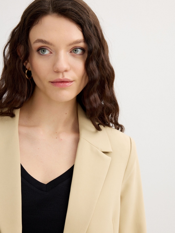 Blazer with shoulder pads sand detail view