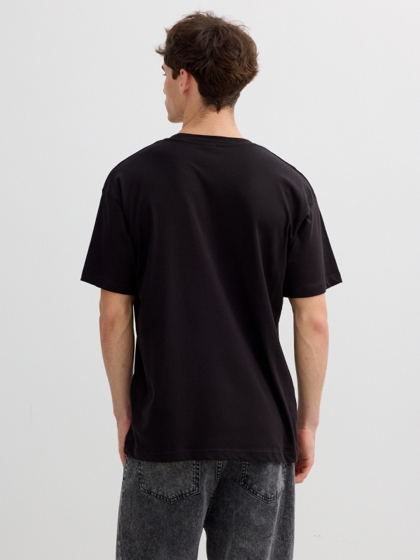 Striped t-shirt with graphic Inside text black middle back view