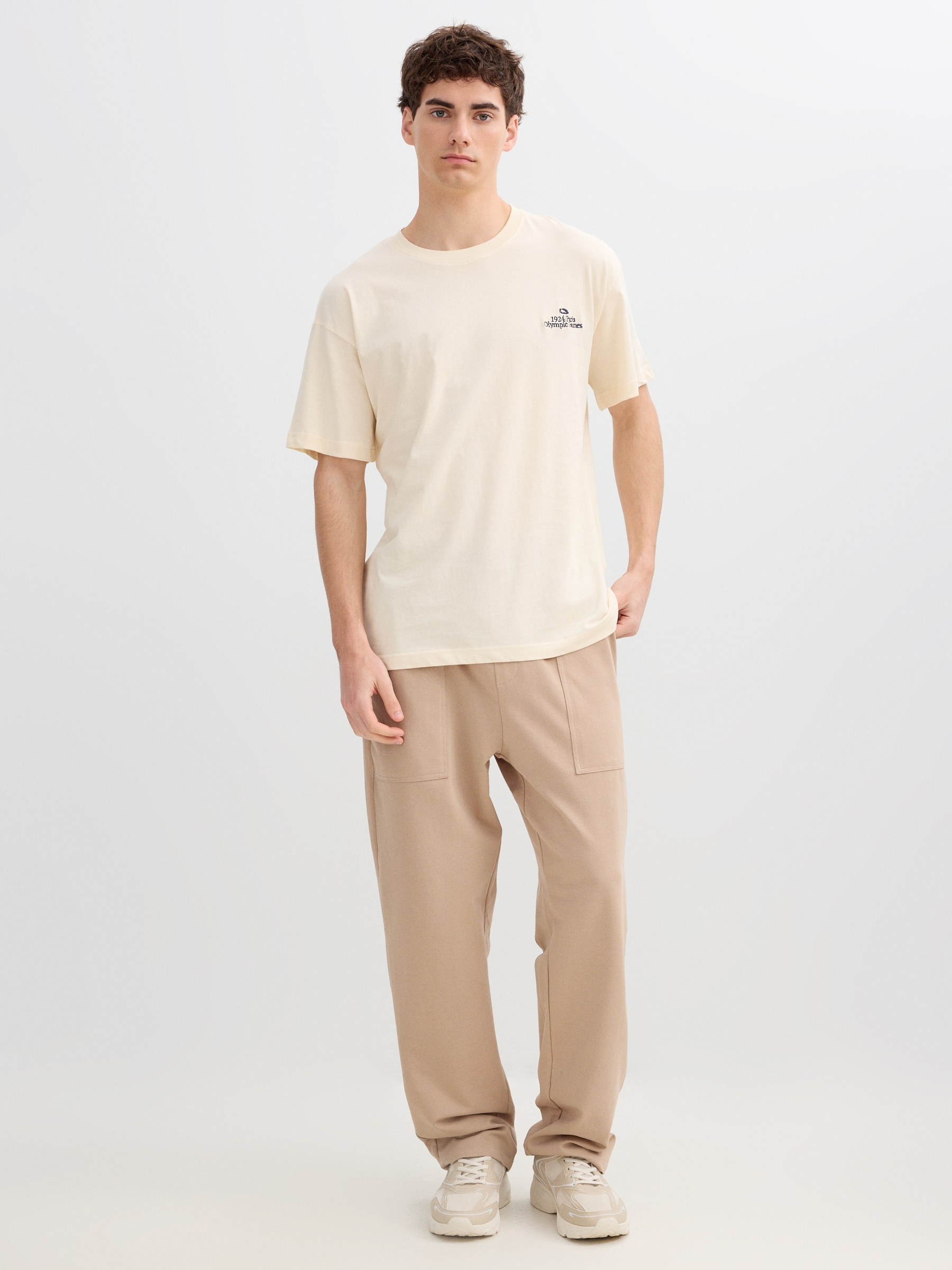 Camiseta Olympic Games off white vista meia frontal