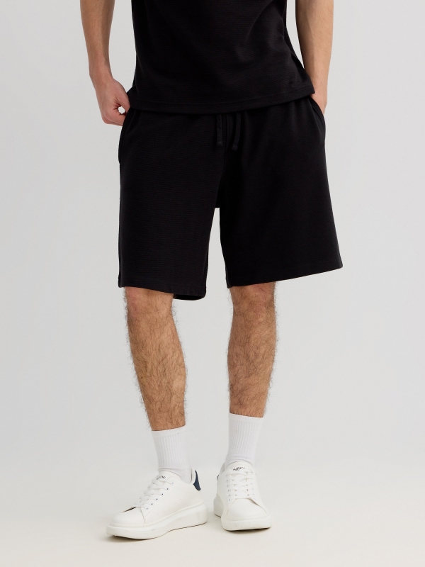 Sports fleece Bermuda with drawstrings black middle back view