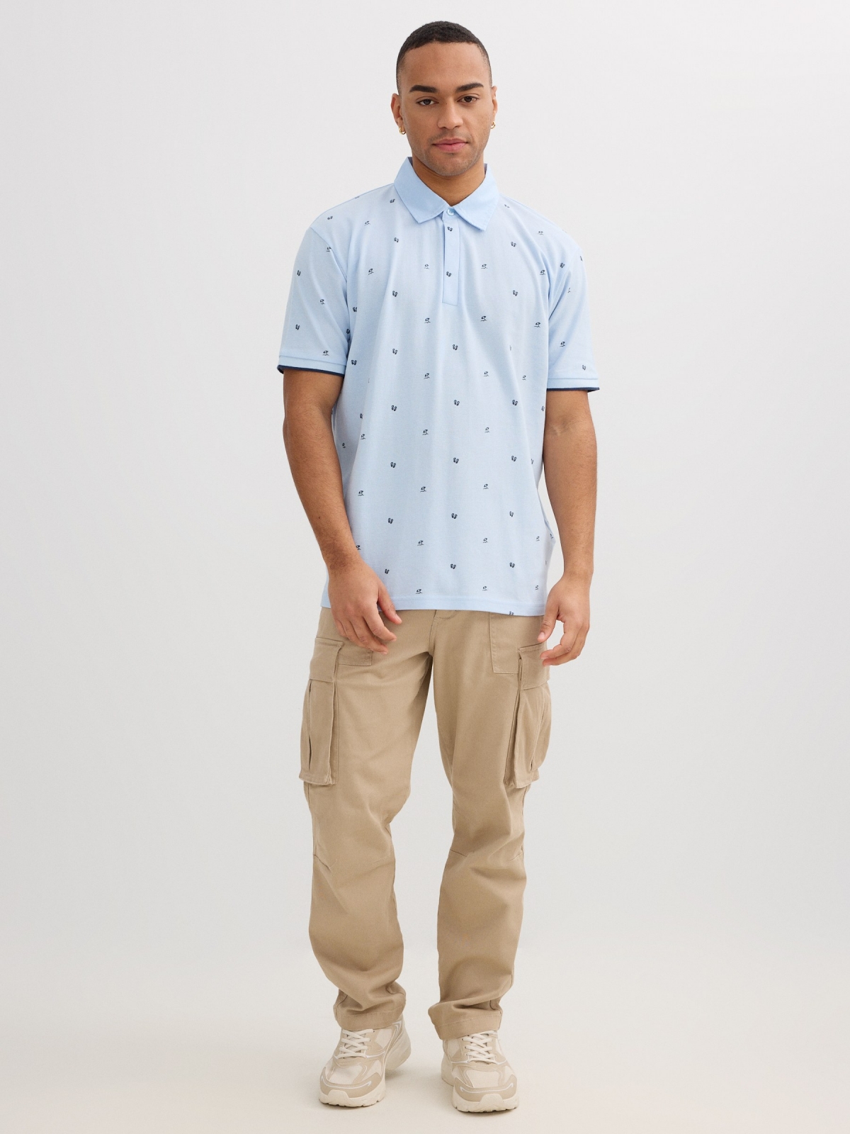 Blue piqué polo with mini print light blue front view