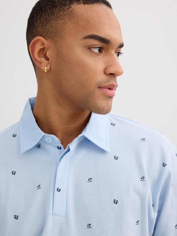 Blue piqué polo with mini print light blue detail view