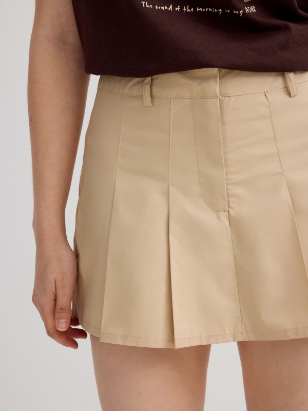 Pleated skort sand detail view