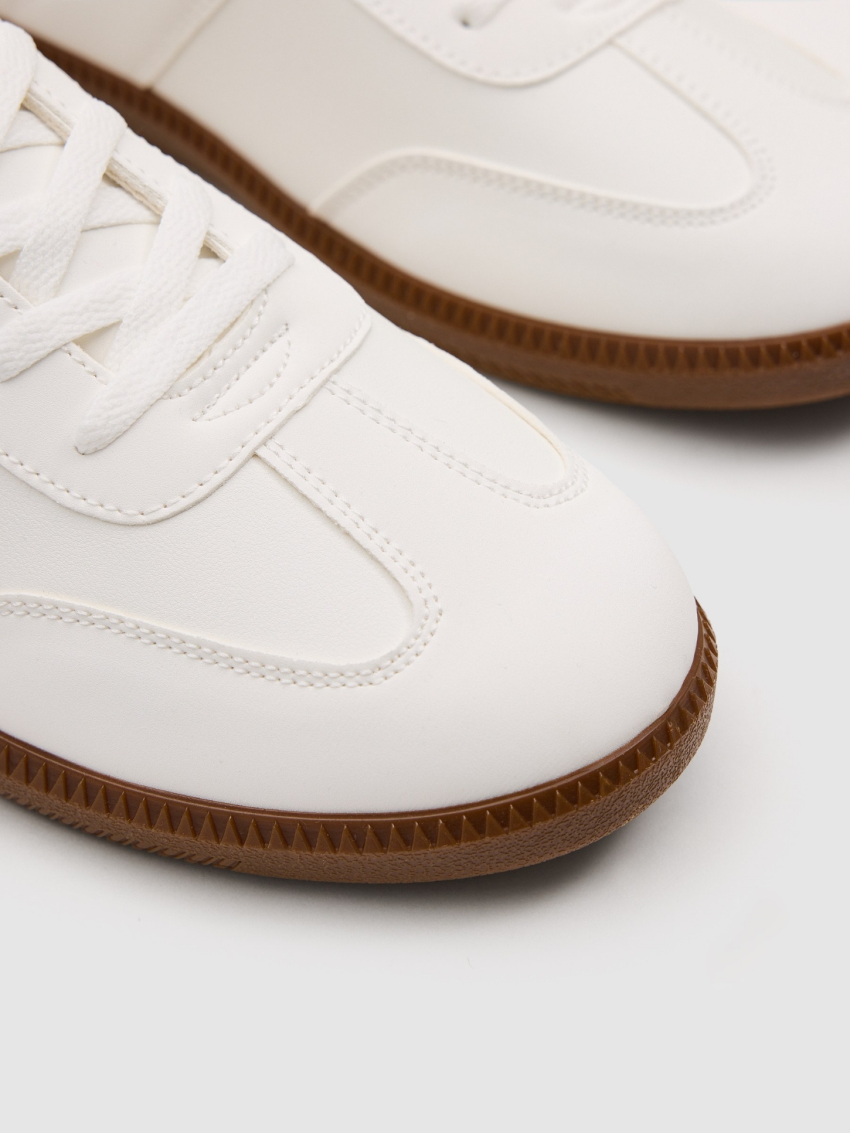 Synthetic leather sports shoes with rubber sole white detail view