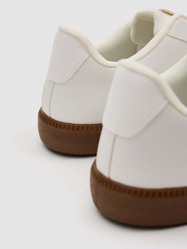 Synthetic leather sports shoes with rubber sole white detail view