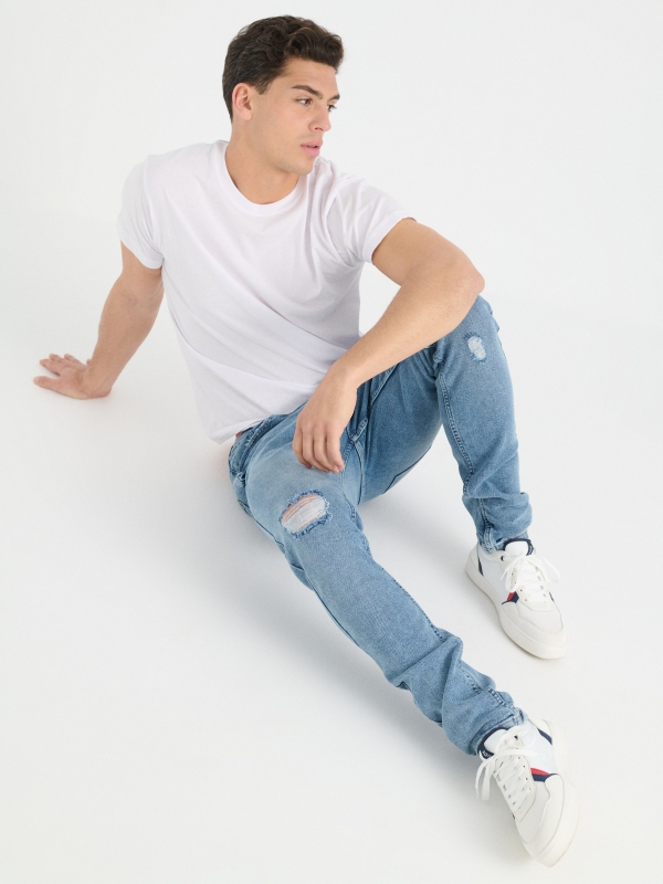 Ripped blue slim jeans blue detail view