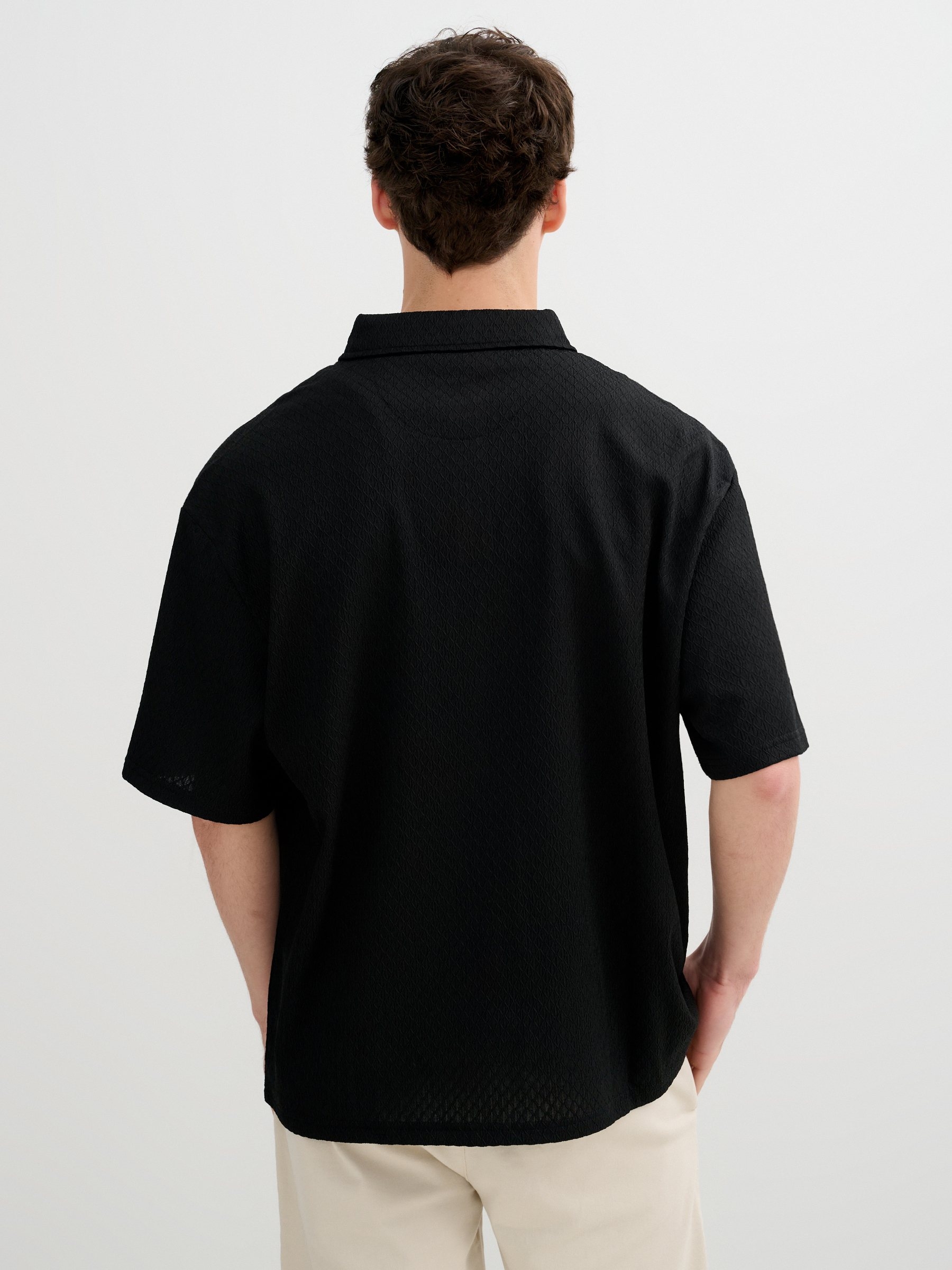 Camisa básica de punto con botones negro vista media frontal