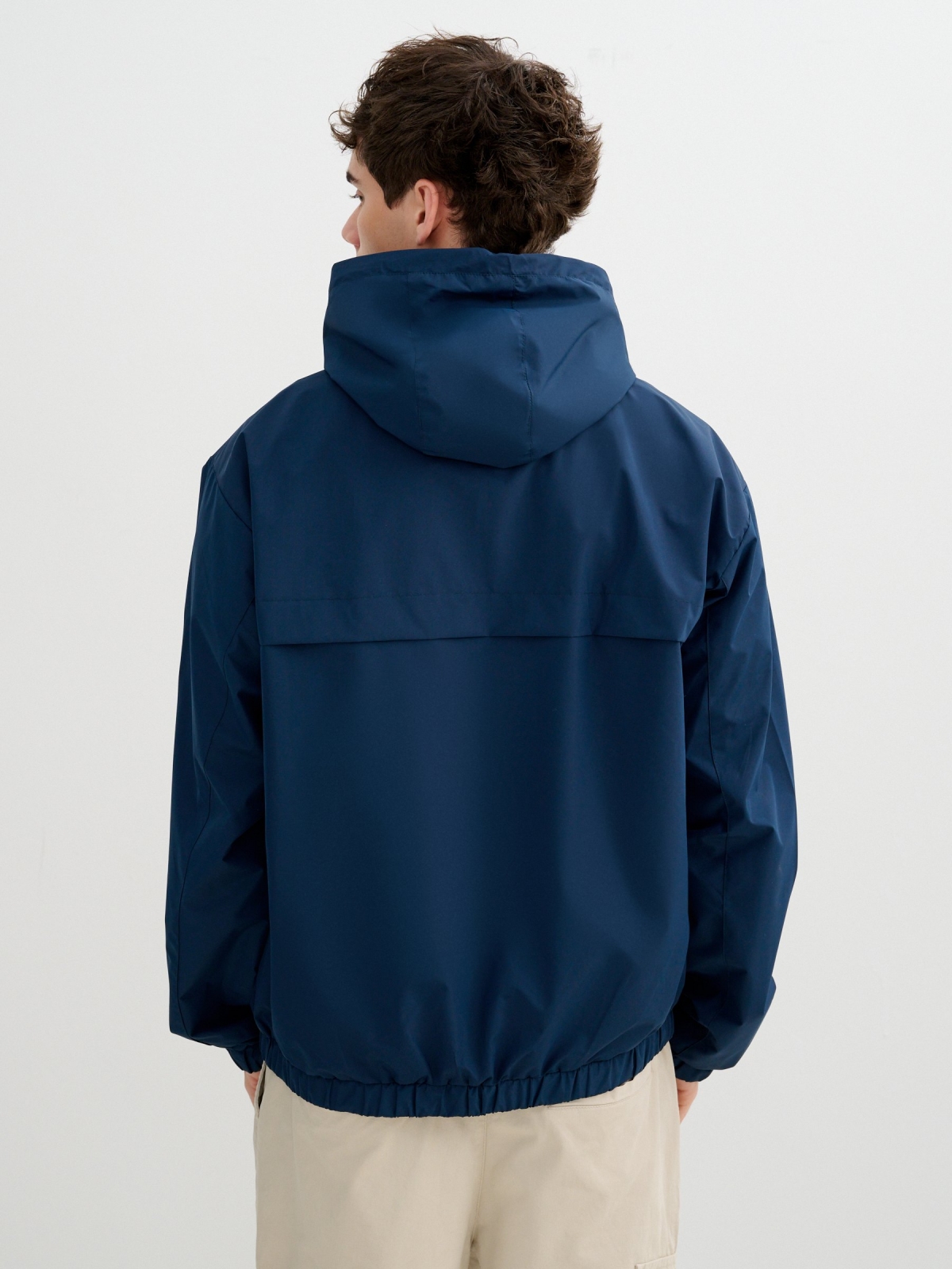 Light jacket with hood and zipper petrol blue middle back view