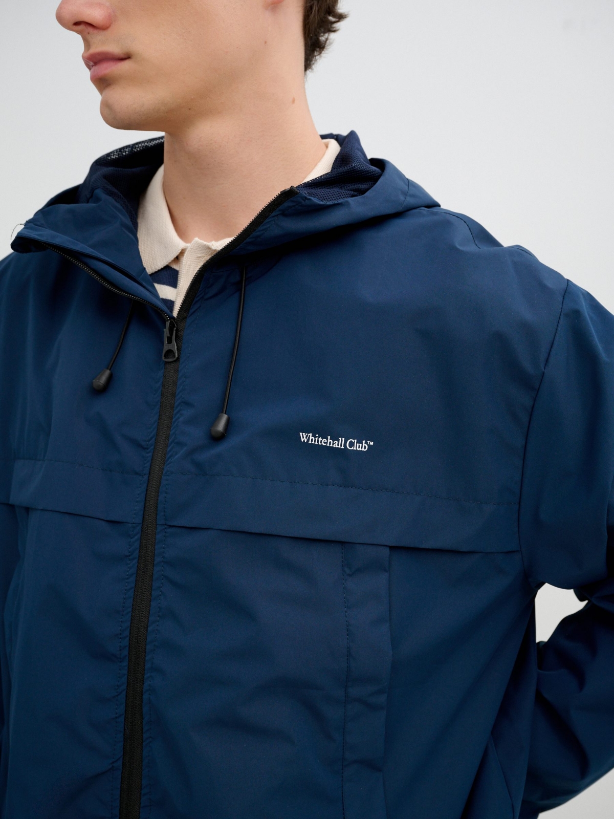 Light jacket with hood and zipper petrol blue detail view