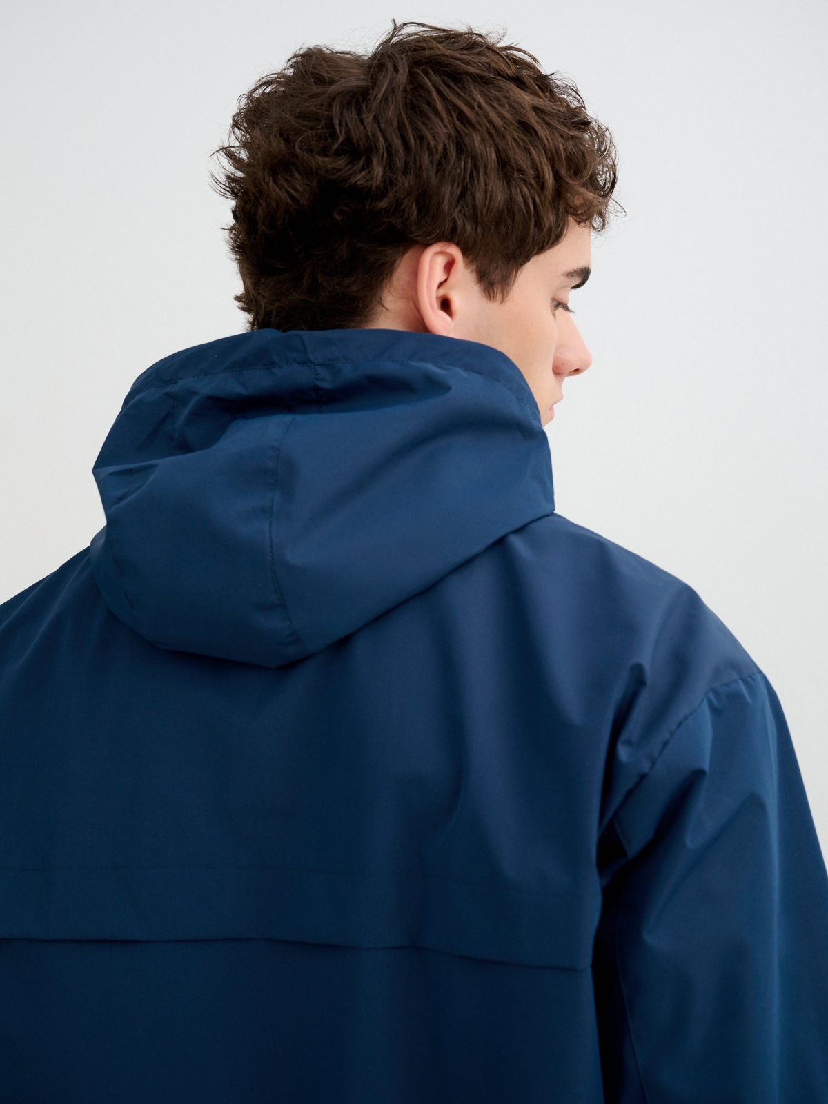 Light jacket with hood and zipper petrol blue detail view